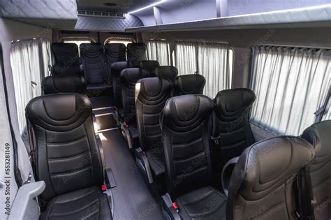 comfortable passenger bus interior with upholstered seats; individual ...