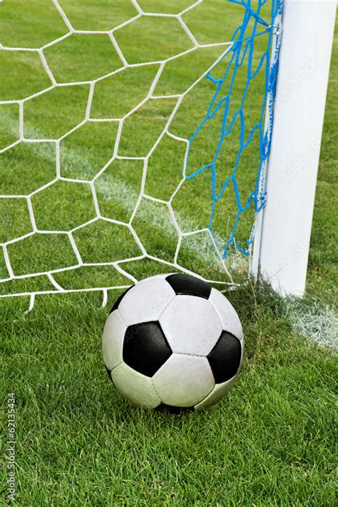 soccer ball in goal net Stock Photo | Adobe Stock