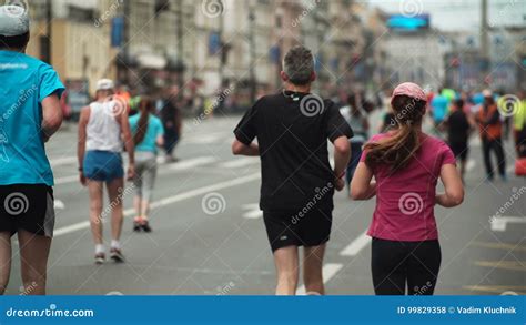 Big Crowd are Running the Marathon in the City Road Together. Group of ...