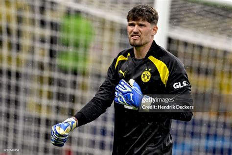 Goalkeepers Gregor Kobel of Borussia Dortmund reacts as he warms up ...