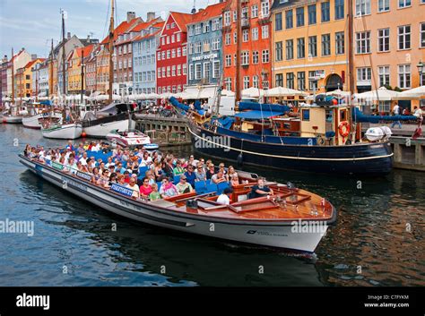 Copenhagen canal cruise tour boat in Nyhavn Stock Photo - Alamy