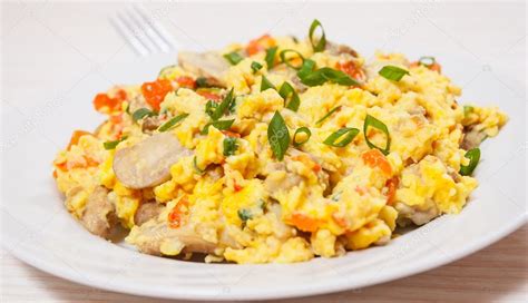 Scrambled eggs with mushrooms and vegetables Stock Photo by ©semenovp ...