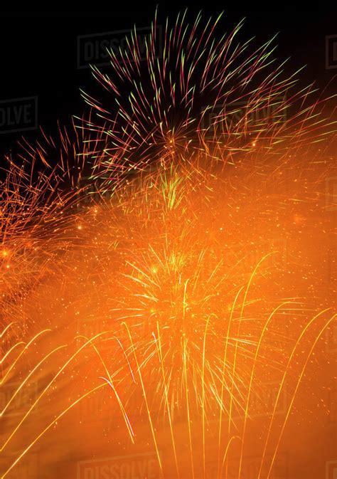 Fireworks explosion against night sky - Stock Photo - Dissolve