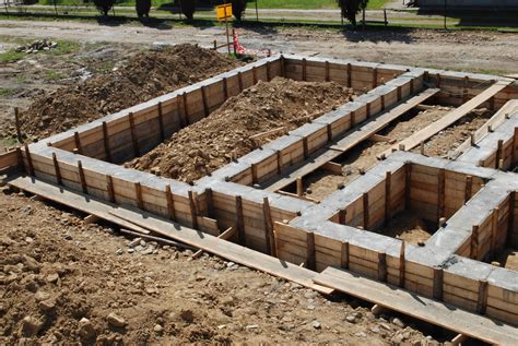 3 Common Types of Building Foundations - Brown Concrete and Backhoe