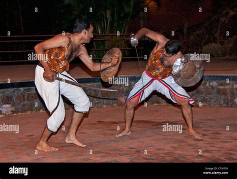 Kalaripayattu, or Kalari martial art of Kerala, with combatants using ...