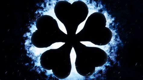 four leaf clover in the middle of a blue circle with rain falling down ...