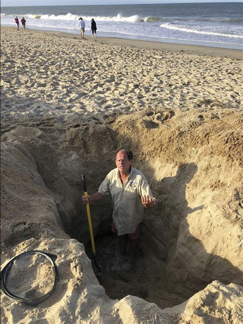 Digging deep holes on the beach can be deadly : NPR