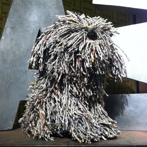 Rolled-Up Newspapers Make The Dog – Kitschy Kitschy Coo