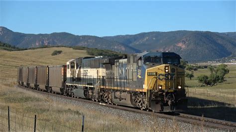 CSX 531 (YN2 paint scheme) leading BNSF coal train with Executive MAC ...