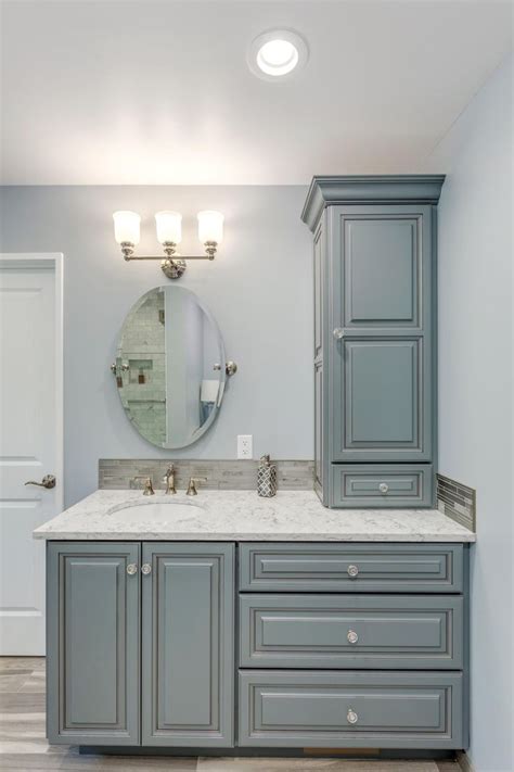 A custom vanity with storage tower. #CustomDesignBathroomCabinets ...