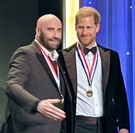 Prince Harry steps out solo to accept aviation award with John Travolta ...