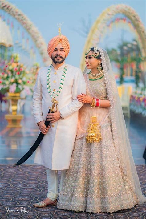 Bride And Groom In Pink And Gold Saree And White Sherwani | Punjabi ...