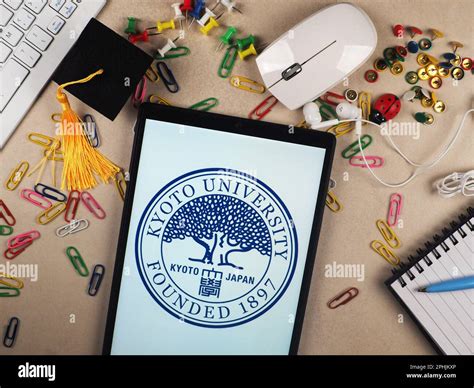 In this photo illustration, Kyoto University logo seen displayed on a ...