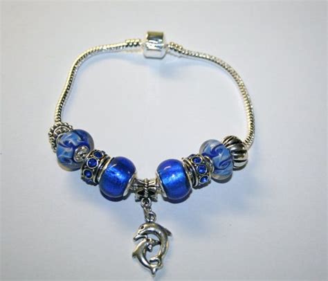 Blue Beaded Dolphin Charm Bracelet by TheSisters3Boutique on Etsy, $19. ...