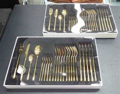 CUTLERY SETS, a boxed pair, 24 pieces in total, 44cm x 28cm (box). (2)