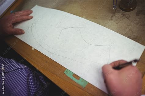 Cobbler making a shoe sketch on paper Stock Photo | Adobe Stock