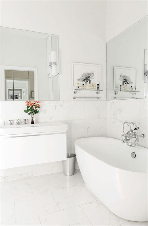 Marble tiles in a bathroom half way up the wall | White bathroom ...