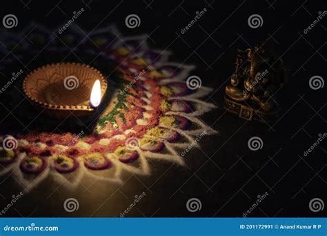 Diwali Diya Colorful Rangoli Design and Lord Ganesha with Dark ...