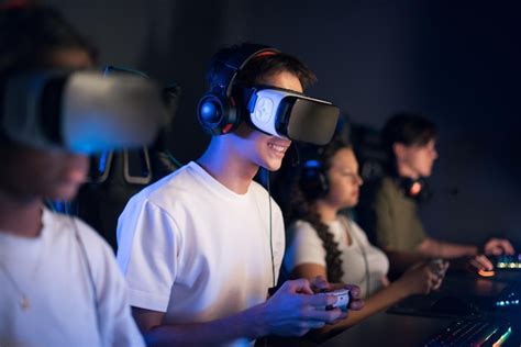 Free Photo | Teen smiling boy in VR headset playing video games in ...