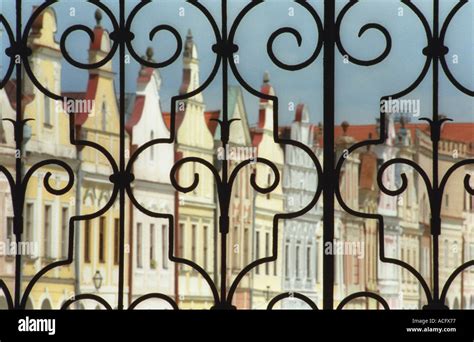 Iron gate with building in background Stock Photo - Alamy