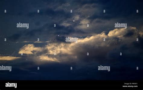 Dark cloudy night sky with stars Stock Photo - Alamy