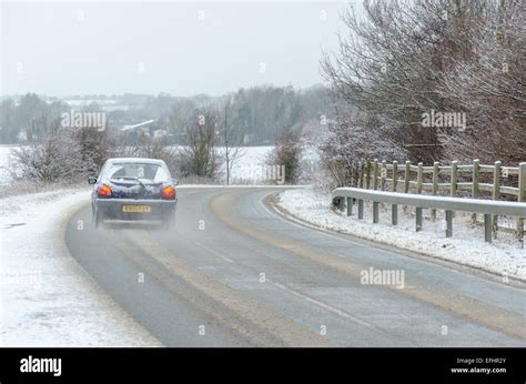 Car on a snowy road Stock Photo - Alamy