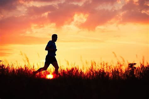 Athletic runner at the sunset - Silhouette of runner. Outdoor cross ...