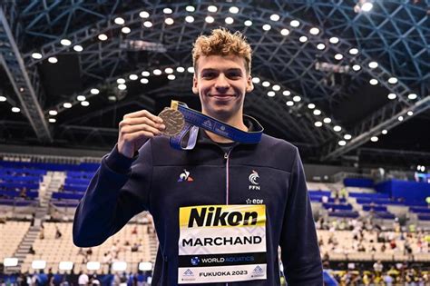 Swimming: France's Marchand wins 200 IM world title for third gold ...