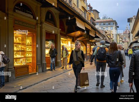 Florence, Italy, jewelry shops on Ponte Vecchio with shoppers Stock ...