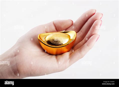 Chinese traditional currency gold yuanbao ingots Stock Photo - Alamy