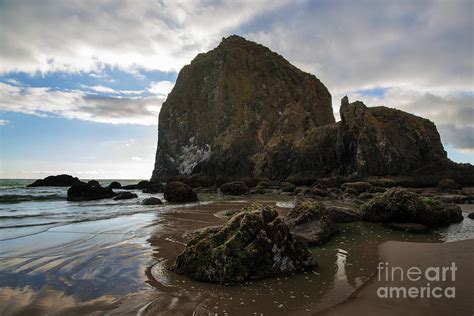 Tide Pools Reflect Haystack Rock At Cannon Beach Photograph by Yefim Bam