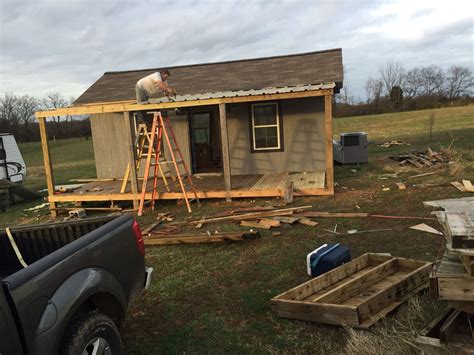 Front porch almost complete! My husband installing reclaimed tin for ...