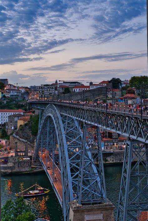 Vertical Shot of a Beautiful Bridge Above the Water in Oporto, Portugal ...