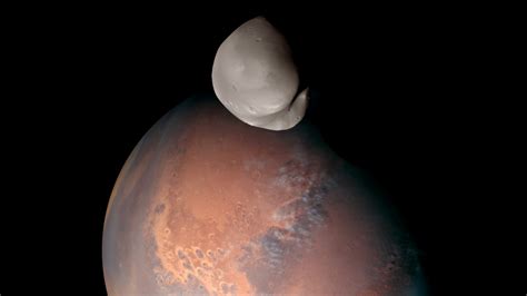 This is our 1st detailed look at Mars' most mysterious moon Deimos ...