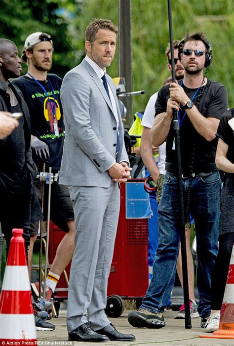 Ryan Reynolds suits up in grey filming The Hitman's Bodyguard with ...