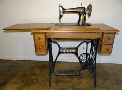 Singer treadle sewing machine, oak cabinet