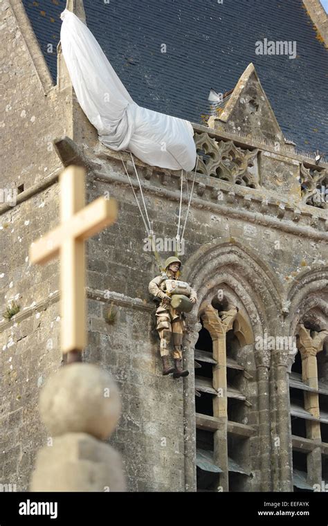 D-Day Parachute Memorial at the Church in Sainte-Mere-Eglise Stock ...