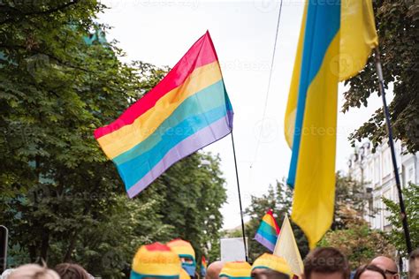 Rainbow flags waving over the crowd during the Pride Parade 11369489 ...