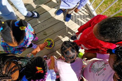 Premium Photo | African american nigerian children playing with bubble ...