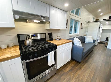 Uncharted Tiny Homes | The Mansion Elite | Tiny house, L shaped kitchen ...