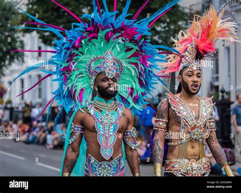 Two men dressed in bright coloured costumes at the Notting Hill ...