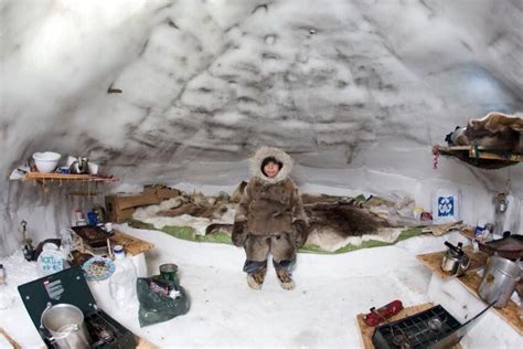 Inuit child in an Arctic igloo, Gjohaven, Canada Photograph by Ton ...