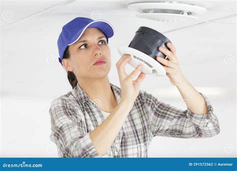 Female Contractor Installing Ceiling Vent Stock Photo - Image of cooler ...