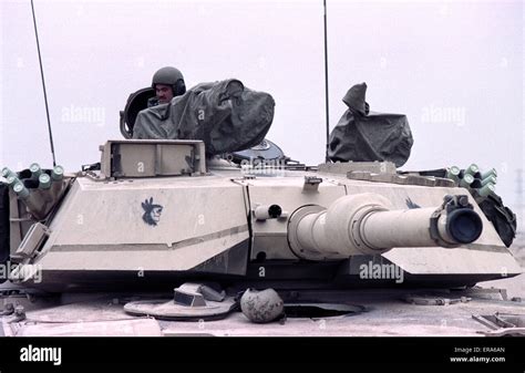 23rd March 1991 An American tank crew member on his M1A1 Abrams tank ...