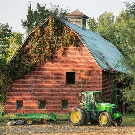 Vintage Barn and Green Farm Tractor 1x1 Photograph by Gregory Ballos ...