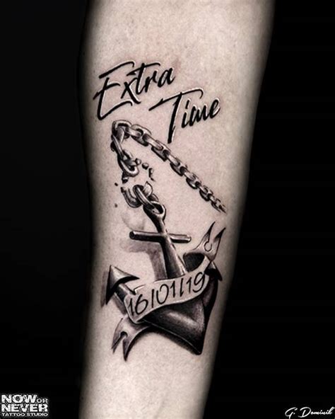 black and grey realistic anchor tattoo