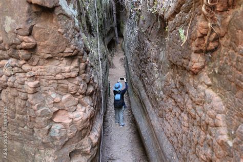 Naga cave, Asian woman using smart phone to take a photo of Naga scales ...