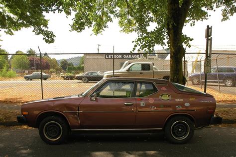 OLD PARKED CARS.: 1976 Datsun F10 Hatchback.