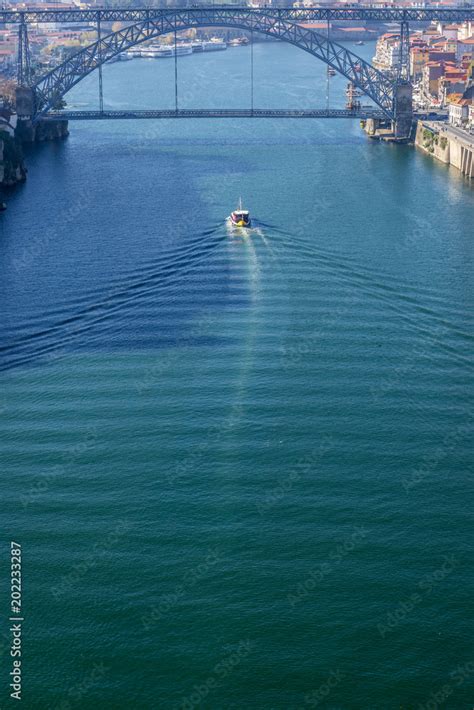 Douro River view with famous bridge of Dom Luis I connected cities of ...