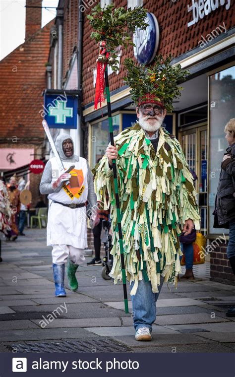 Mummers dressed in traditional costume make there way along Haslemere ...